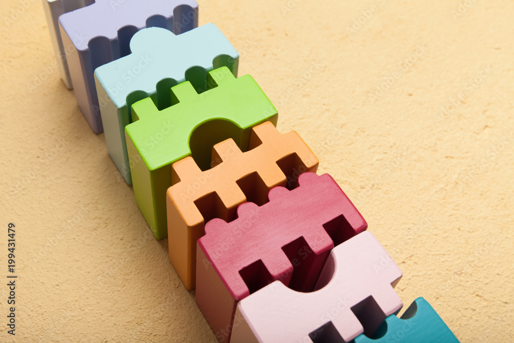Poster cubes of different shapes in a row, team building concept.