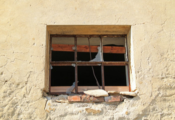 broken window of an old abandoned house, Vendryne, Czech Republic