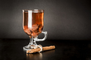 Glass with compote on black background