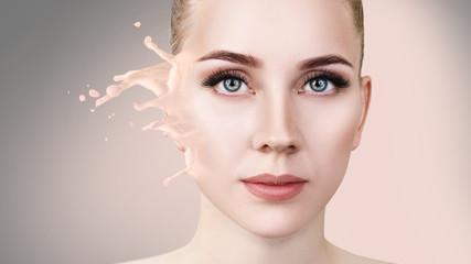 Foundation splashes on beautiful woman's face.