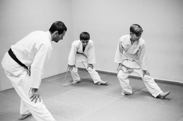 Children in kimono begin training on aikido