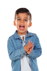 Funny child with dark hair clapping and singing