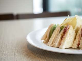 Sandwich ham cheese on white plate