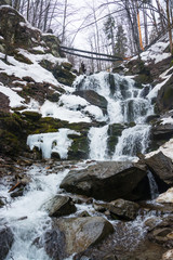 Waterfall in the spring in the mountains