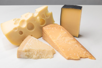Closeup view of different types of cheese on gray