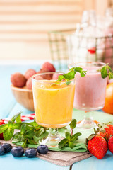 Orange persimmon blueberry smoothie   and fruits. Selective focus. Copy space. Top view