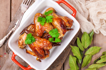 The baked chicken wings. Selective focus. Top view.