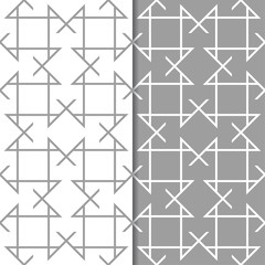 Gray and white geometric ornaments. Set of seamless patterns