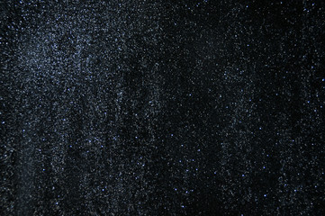 Fototapeta na wymiar Black glitter texture abstract background