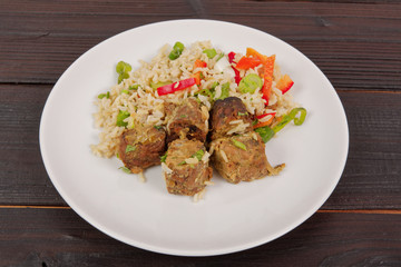 Thai tempeh with coriander and rice on a table