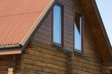 Type of an end face of a roof of the wooden two-storeyed rural house