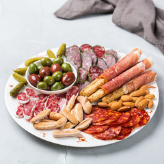 Assortment of spanish tapas or italian antipasti with meat