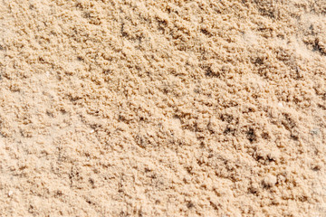 Sand Texture. Brown sand. Background from fine sand. Sand background