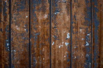 Wooden trims with blue and white paint residues background