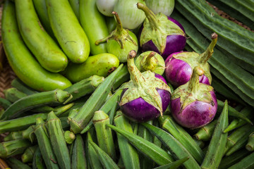 Closeup view of Asian eggplants. Organic colorful eggplants. Pile of eggplants at farmer's market.