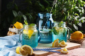 Citrus lemonade water with lemon sliced and mint in blue jar