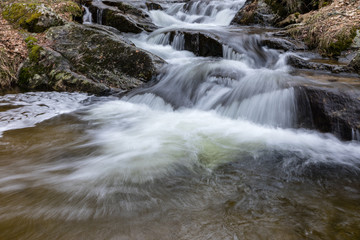 Fototapeta premium Waterfall from snow melt in the mountains of Madrid, Spain
