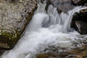 Fototapeta premium Waterfall from snow melt in the mountains of Madrid, Spain