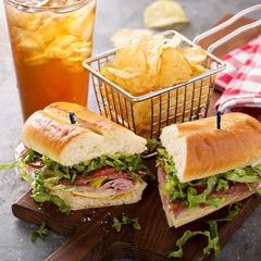 Tuinposter Italian sub sandwich with chips © fahrwasser