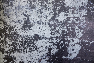 Old, worn, scratched and peeling brown painted concrete wall. Texture for background. Copy space for text.