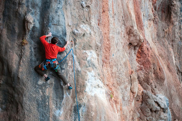 Fototapeta premium A man climbs the rock.