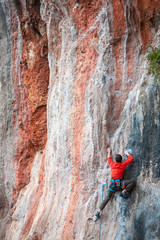Fototapeta premium A man climbs the rock.