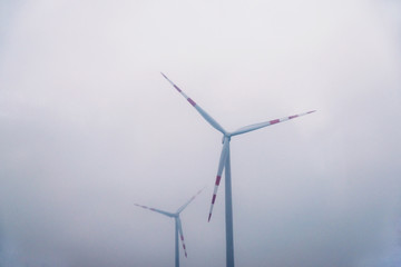 wind turbines on the background of smog, Eco power concept