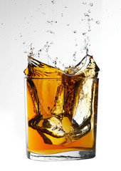 alcohol liquor whisky splash in clear glass with stop action