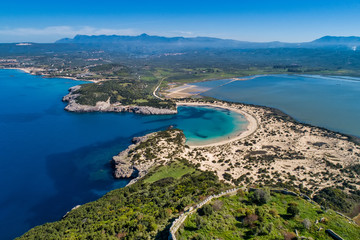 Obraz premium Panoramic aerial view of voidokilia beach, one of the best beaches in mediterranean Europe, beautiful lagoon of Voidokilia from a high point of view, Messinia, Greece