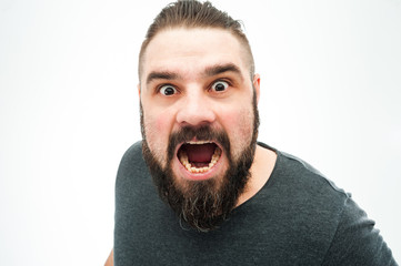 Closeup portrait of angry, mad, annoyed, skeptical, grumpy man, employee, worker isolated on white background. Human emotions, face expressions, reaction, interpersonal conflict resolution