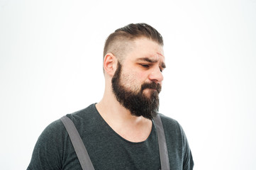 Obraz premium Closeup portrait of angry, mad, annoyed, skeptical, grumpy man, employee, worker isolated on white background. Human emotions, face expressions, reaction, interpersonal conflict resolution