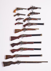 collection of ancient guns and pistols