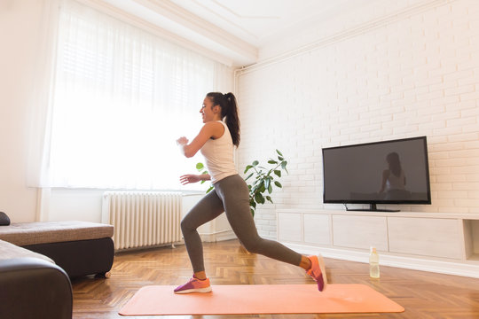 Fit young woman exsercise in the room