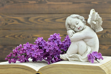 Condolence card. Guardian angel and lilac flower