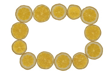 Round slices of golden yellow citrus juicy fruit on a white background