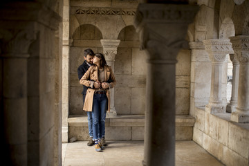 Fototapeta na wymiar Loving couple in the historical area of Budapest, Hungary
