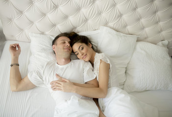 Loving couple in the bed