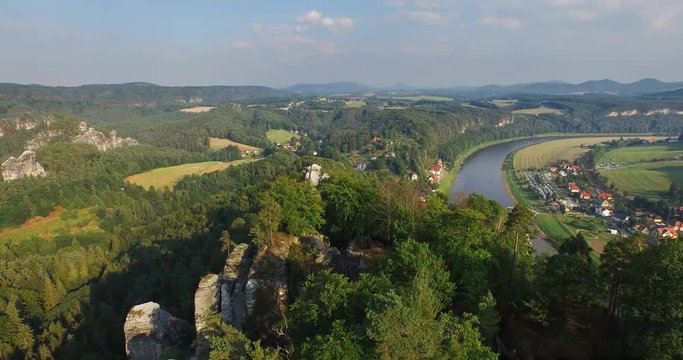 Aerial view a magnificent panoramic view of Bastai in Germany next to the river on a sunny day. On the background beautiful scenic nature.