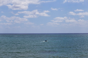 Fototapeta na wymiar Blue clear and calm ocean on a sunny day 