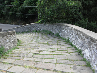 Descent stone walkway of medieval bridge known as Ponte del Diavolo in Borgo a Mozzano, Italy