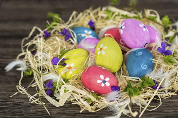 Easter Eggs with Blue Painted Flowers   on a Wooden  Background. Easter Decoration. Decoupage ideas .