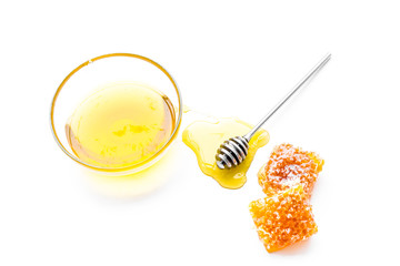 Honey background. Honey dipper and honeycomb on white background top view