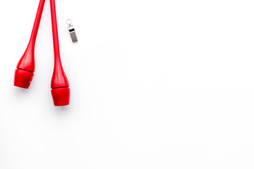 Maces for rhythmic gymnastics on white background top view copy space