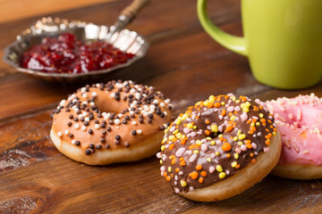 Dougnut filled with crimson jam and cold coffee - Hanukkah