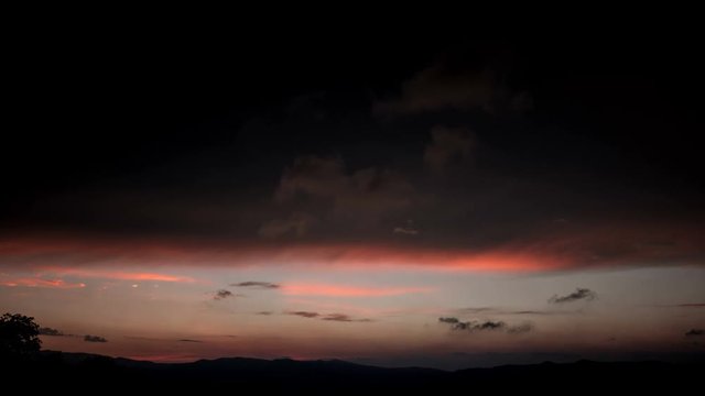 Timelapse of a cloudy sky at dusk