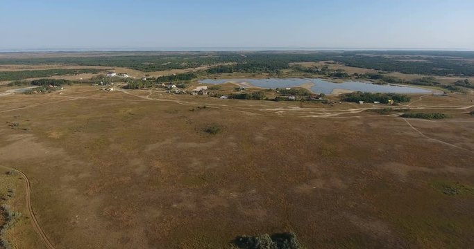 Aerial fantastic view Morning landscape on coast of a calm sea and sand spit among a salt lake, kinburn foreland