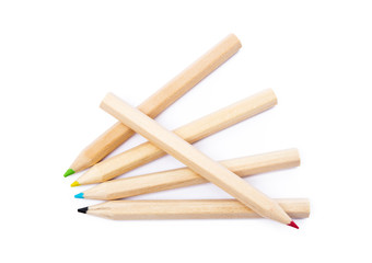 Wooden colorful ordinary pencils isolated on a white background