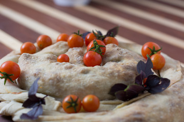 spiral filo pie burek with cherry tomatoes