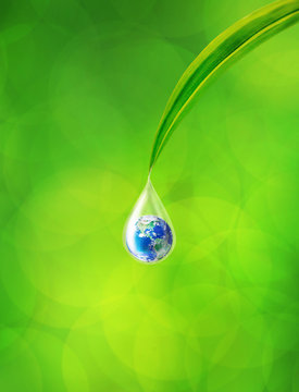 Earth in water drop reflection under green leaf, Element of this image furnished by NASA