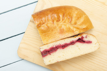 Homemade vegetarian fruit pie closeup on cutting board. Still life top view with copy space